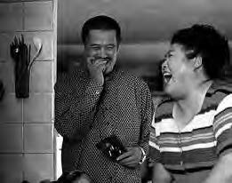 a man and woman laugh together