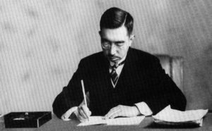 Emperor Hirohito signing the Constitution of Japan. 