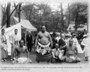 several people watch a sumo match
