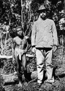 a photo of a tall white man and a short black man