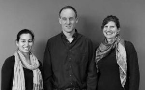 photo of two middle aged women and a middle aged man