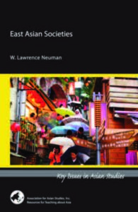 Book cover of East Asian Societies. The cover photograph is of a vibrant city scene with many murals. 