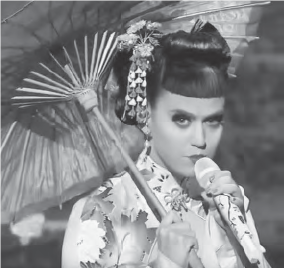Screenshot of a western woman in a Japanese kimono singing with a Chinese style umbrella