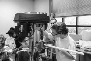 Students build a counter scale during class. 