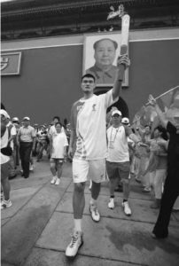 photo of a man holding a torch