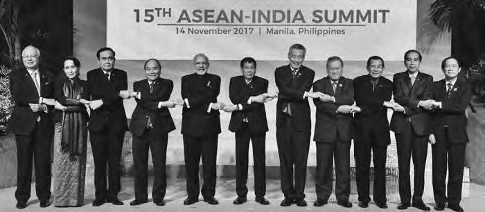 group photo of people in suits shaking hands with each other