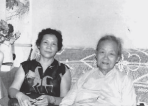 Image of two women sitting in sofa.