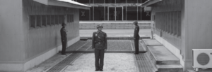 Three guards stand alert at the Korean Demilitarized Zone