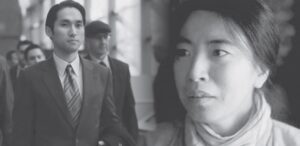 black and white photo of a woman and a man in a suit