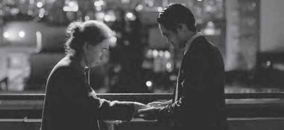 black and white photo of a man and woman holding hands