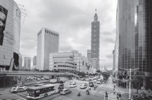photo of a four way crossing that is busy with many cars