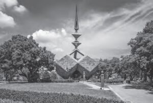 photo of a monument that looks like a knife in a sky