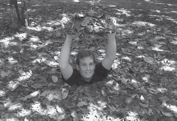 photo of a man coming out of a hole in the ground