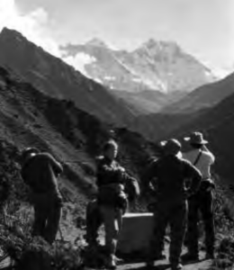 Photo of four people standing in the valley.