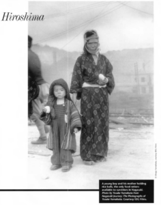 A young boy and his mother holding rice balls, the only food rations available to survivors in Nagasaki. Photo by Yosuke Yamahata from Nagasaki Journey: The Photographs of Yosuke Yamahata. Courtesy IDG Films.