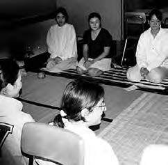 a few people sit on the floor