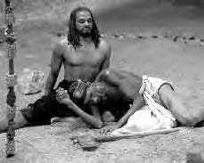 two men lay on the ground exhausted