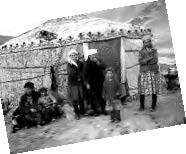 a family in front of a yurt