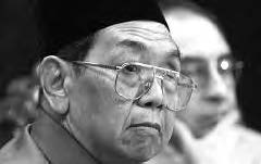 an old man wearing glasses