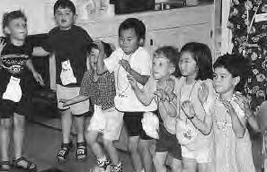 photo of several children making claws with their hands