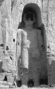 a statue carved into the rock wall