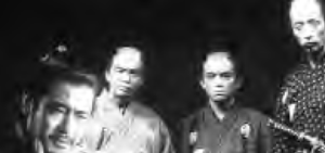 four middle aged men look on