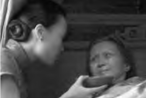 a woman feeds another woman