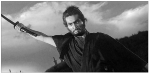 Image shows a men holding knife in his hand with fierce face