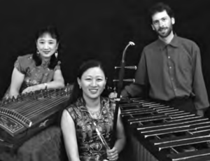 Photo of three people with their musical instruments
