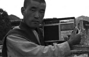 photo of a man holding a radio