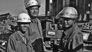photo of several men in suit and helmets 